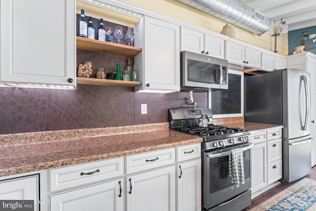 68 Gregg Dr, Manahawkin, NJ 08050 - kitchen featuring stainless steel appliances, white cabinets, decorative backsplash, wood finished floors, and open shelves