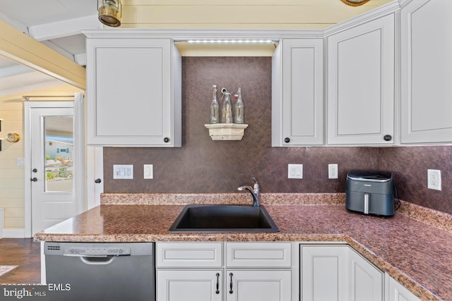 68 Gregg Dr, Manahawkin, NJ 08050 - kitchen featuring dishwasher, a sink, white cabinetry, and beamed ceiling