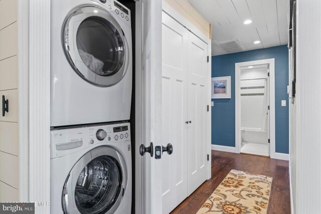 68 Gregg Dr, Manahawkin, NJ 08050 - laundry area with stacked washer / dryer, dark wood finished floors, baseboards, and recessed lighting