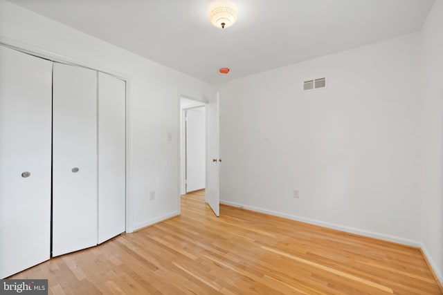 1612 Lemontree Ln, Silver Spring, MD 20904 - unfurnished bedroom with light wood finished floors, baseboards, and a closet