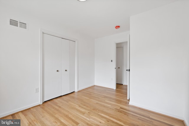 1612 Lemontree Ln, Silver Spring, MD 20904 - unfurnished bedroom with light wood-type flooring, a closet, and baseboards