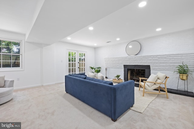 1612 Lemontree Ln, Silver Spring, MD 20904 - carpeted living area with a brick fireplace, recessed lighting, healthy amount of natural light, baseboards, and french doors