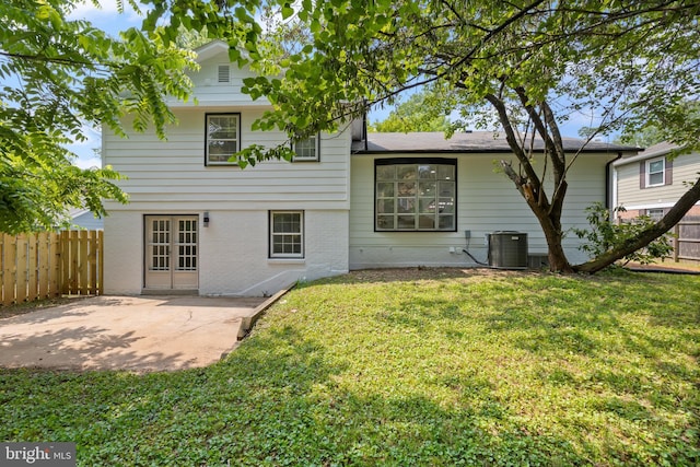 1612 Lemontree Ln, Silver Spring, MD 20904 - rear view of house featuring brick siding, cooling unit, a patio, and french doors