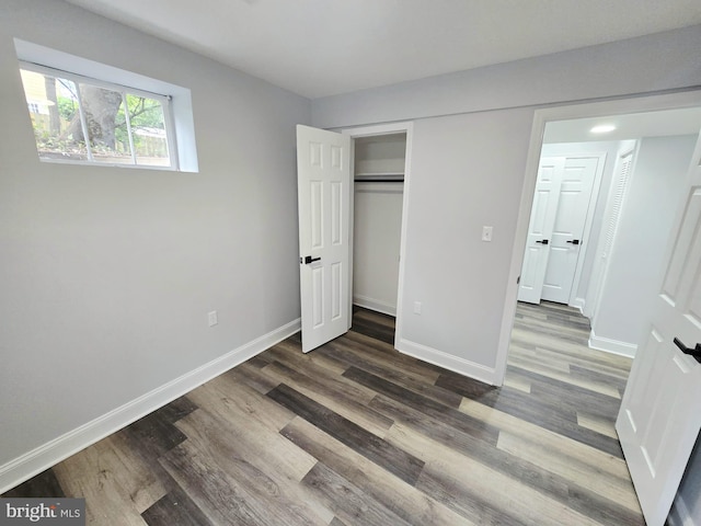 1612 Lemontree Ln, Silver Spring, MD 20904 - unfurnished bedroom featuring wood finished floors, baseboards, and a closet