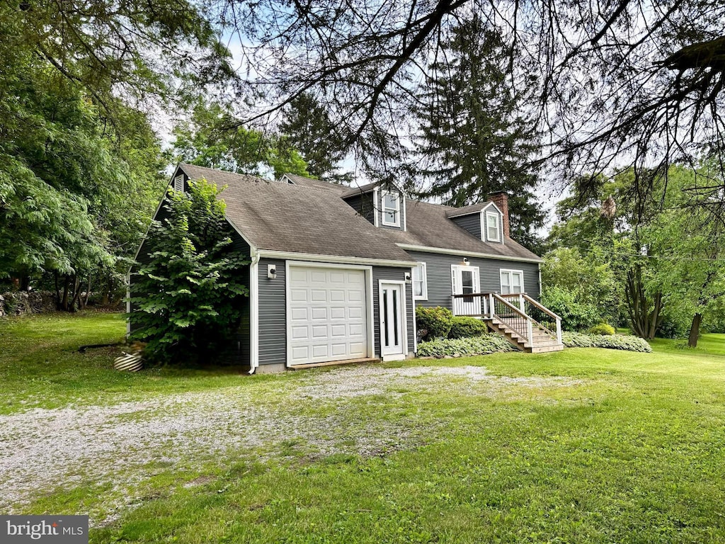 3095 Carlisle Rd, Gardners, PA 17324 - view of front of house with a front lawn, a chimney, and an attached garage