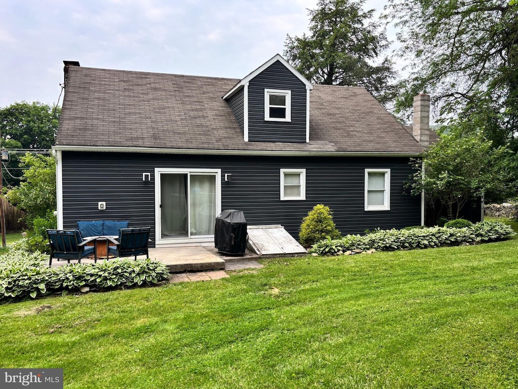 3095 Carlisle Rd, Gardners, PA 17324 - rear view of house featuring a lawn, a patio area, an outdoor hangout area, a chimney, and a shingled roof