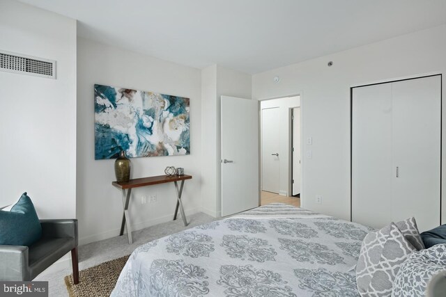 2101 Market St Unit 3605, Philadelphia, PA 19103 - carpeted bedroom featuring baseboards and a closet