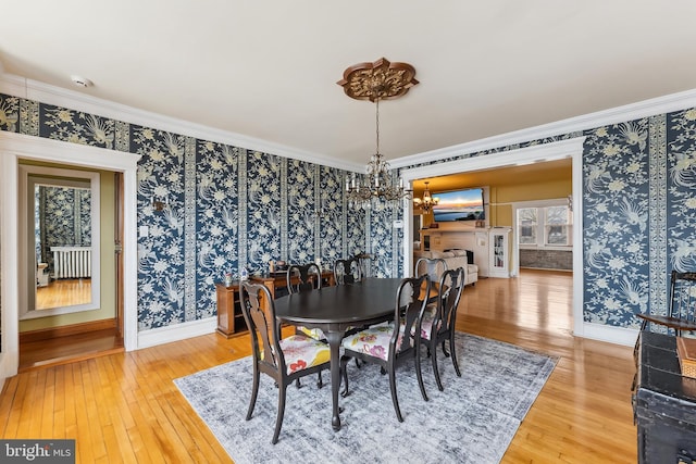 1 S Bartram Ave Unit 3, Atlantic City, NJ 08401 - dining room featuring a chandelier, baseboards, light wood-style flooring, wallpapered walls, and ornamental molding