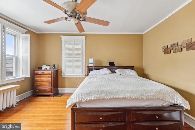 1 S Bartram Ave Unit 3, Atlantic City, NJ 08401 - bedroom with baseboards, light wood-style floors, crown molding, ceiling fan, and radiator