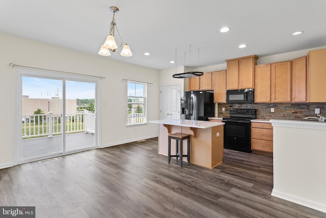 326 Iannelli Rd, Clarksboro, NJ 08020 - kitchen with black appliances, dark wood finished floors, tasteful backsplash, a kitchen island, and baseboards