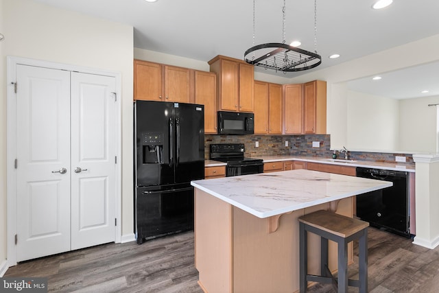 326 Iannelli Rd, Clarksboro, NJ 08020 - kitchen featuring black appliances, wood finished floors, tasteful backsplash, a peninsula, and a sink