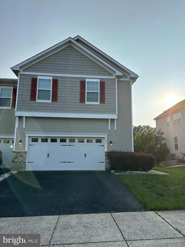 433 Afton Dr, Middletown, DE 19709 - view of front of property featuring stone siding, a garage, and asphalt driveway