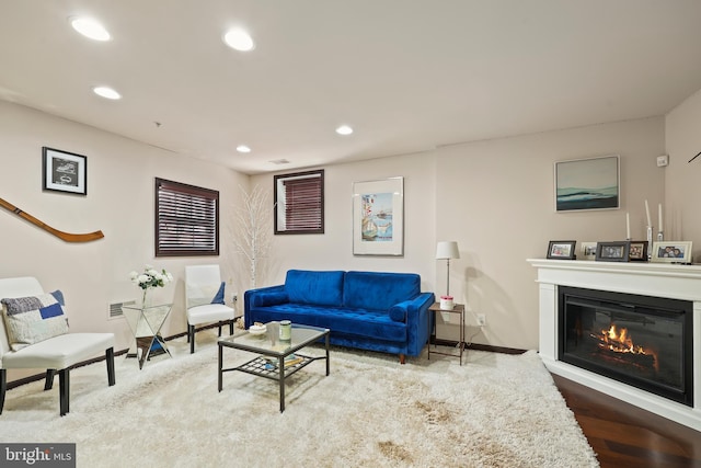 8861 Ashgrove House Ln, Vienna, VA 22182 - living area with recessed lighting, a glass covered fireplace, baseboards, and wood finished floors