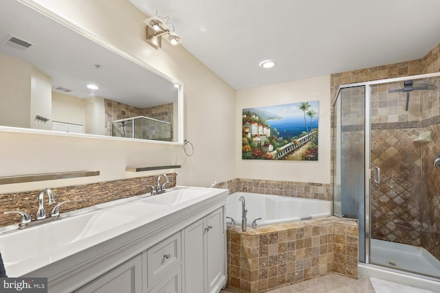 8861 Ashgrove House Ln, Vienna, VA 22182 - bathroom with a garden tub, double vanity, and a stall shower