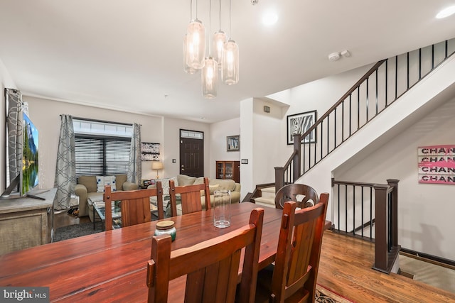 8861 Ashgrove House Ln, Vienna, VA 22182 - dining space featuring wood finished floors and stairway