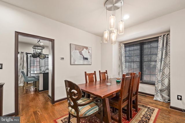 8861 Ashgrove House Ln, Vienna, VA 22182 - dining space featuring dark wood-type flooring and baseboards