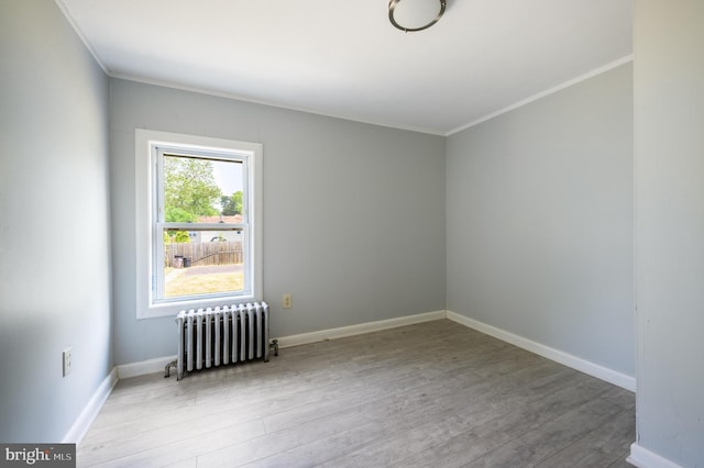 624 Hunt Ave, Trenton, NJ 08610 - empty room featuring radiator, wood finished floors, crown molding, and baseboards