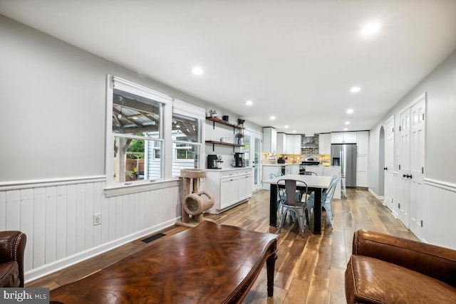 11636 Doxdam Ter, Germantown, MD 20876 - dining room with light wood-type flooring, recessed lighting, and wainscoting