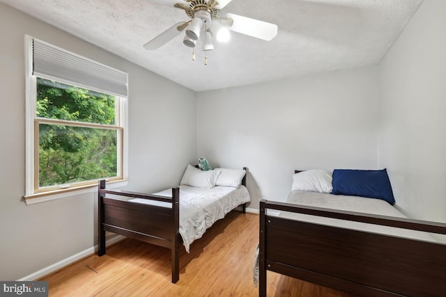 11636 Doxdam Ter, Germantown, MD 20876 - bedroom with light wood-type flooring, baseboards, and a ceiling fan