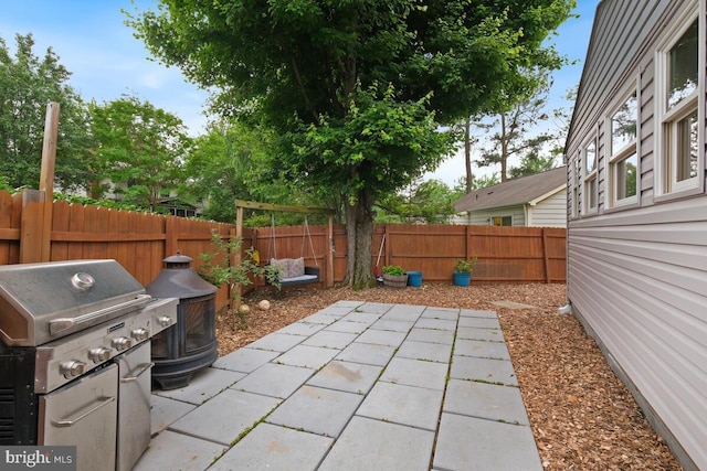 11636 Doxdam Ter, Germantown, MD 20876 - fenced backyard featuring a patio and grilling area