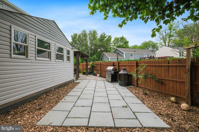 11636 Doxdam Ter, Germantown, MD 20876 - fenced backyard featuring a patio and a grill