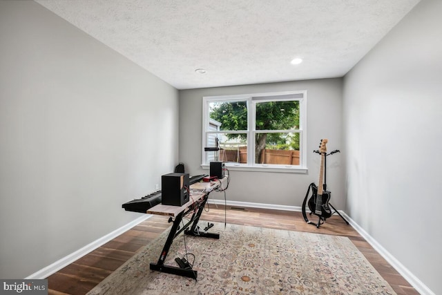 11636 Doxdam Ter, Germantown, MD 20876 - home office featuring wood finished floors, baseboards, a textured ceiling, and recessed lighting
