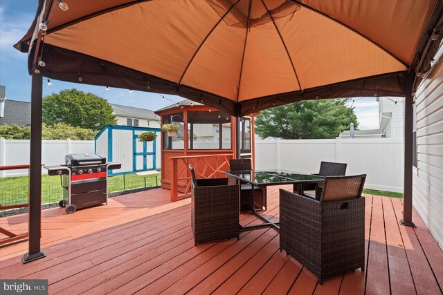 123 E Violette Dr, New Castle, DE 19720 - wooden deck featuring a gazebo, a fenced backyard, grilling area, and outdoor dining space