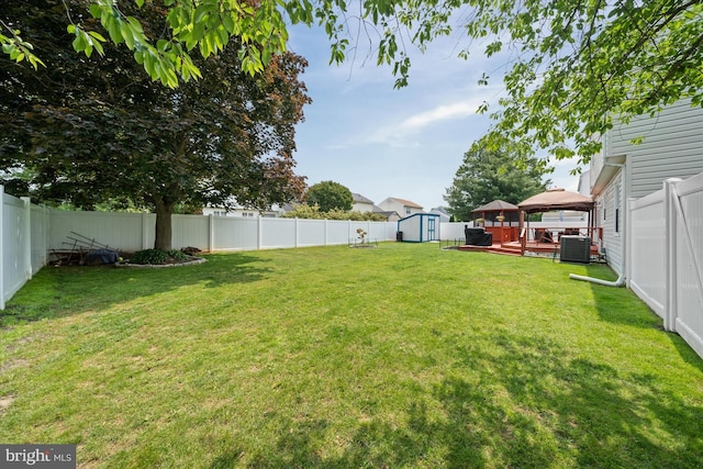 123 E Violette Dr, New Castle, DE 19720 - view of yard with a gazebo, central AC unit, and a wooden deck