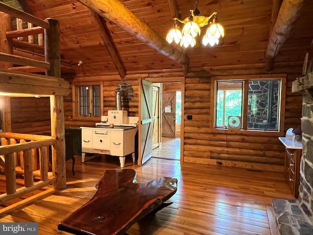 11882 Bumbarger Cir, Petersburg, PA 16669 - living room with hardwood / wood-style floors, a chandelier, wood ceiling, and rustic walls
