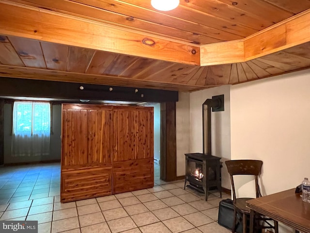 11882 Bumbarger Cir, Petersburg, PA 16669 - living room with light tile patterned floors, wood ceiling, and a wood stove