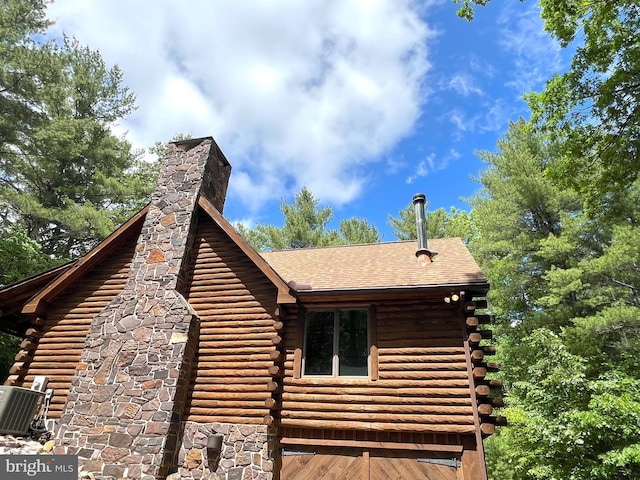 11882 Bumbarger Cir, Petersburg, PA 16669 - view of side of property featuring log exterior, a chimney, and roof with shingles