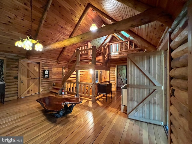 11882 Bumbarger Cir, Petersburg, PA 16669 - unfurnished living room with wooden ceiling, rustic walls, and hardwood / wood-style floors