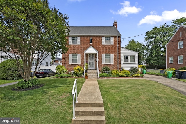 5409 20th Ave, Hyattsville, MD 20782 - view of front of house with a chimney, a front lawn, and brick siding