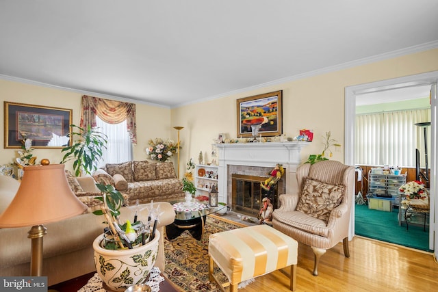 5409 20th Ave, Hyattsville, MD 20782 - living room featuring a fireplace with flush hearth, crown molding, and wood finished floors