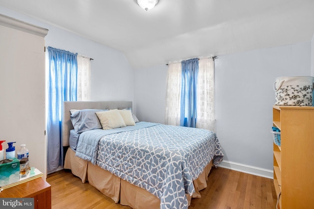5409 20th Ave, Hyattsville, MD 20782 - bedroom with lofted ceiling, wood finished floors, and baseboards