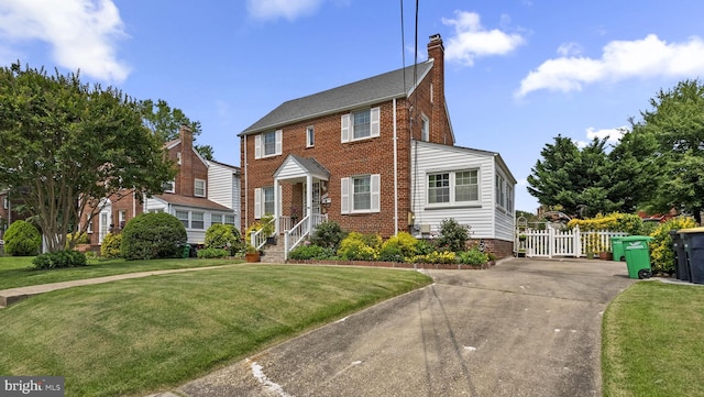 5409 20th Ave, Hyattsville, MD 20782 - view of front of property featuring a chimney, brick siding, and driveway