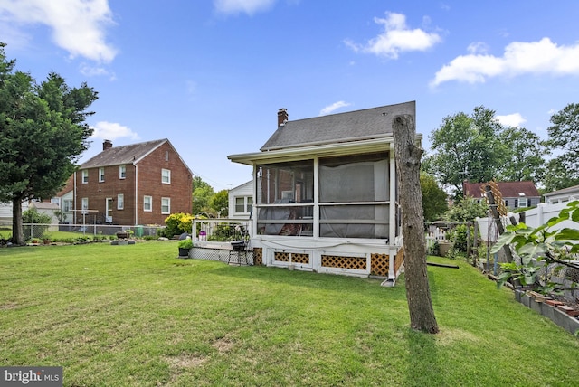 5409 20th Ave, Hyattsville, MD 20782 - rear view of house featuring a sunroom and a chimney