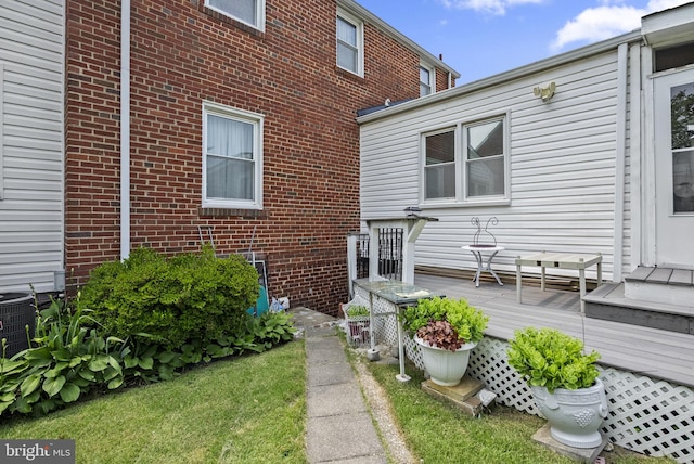 5409 20th Ave, Hyattsville, MD 20782 - back of house with brick siding, a wooden deck, and central AC