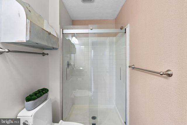 7967 Brightmeadow Ct, Ellicott City, MD 21043 - bathroom featuring a shower stall and a textured ceiling