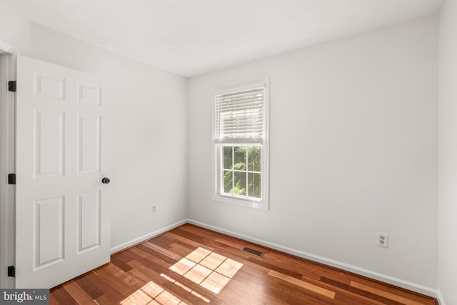 7967 Brightmeadow Ct, Ellicott City, MD 21043 - spare room with plenty of natural light and wood finished floors