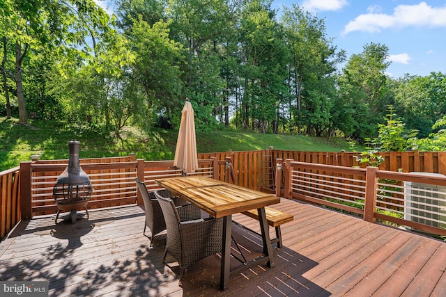 7967 Brightmeadow Ct, Ellicott City, MD 21043 - deck with outdoor dining area and view of wooded area