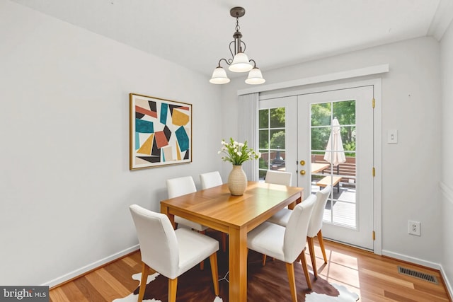 7967 Brightmeadow Ct, Ellicott City, MD 21043 - dining room featuring french doors and light wood-style flooring