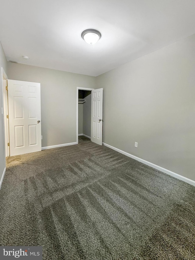 1308 Gallaudet St NE, Washington, DC 20002 - unfurnished bedroom with dark carpet and a closet