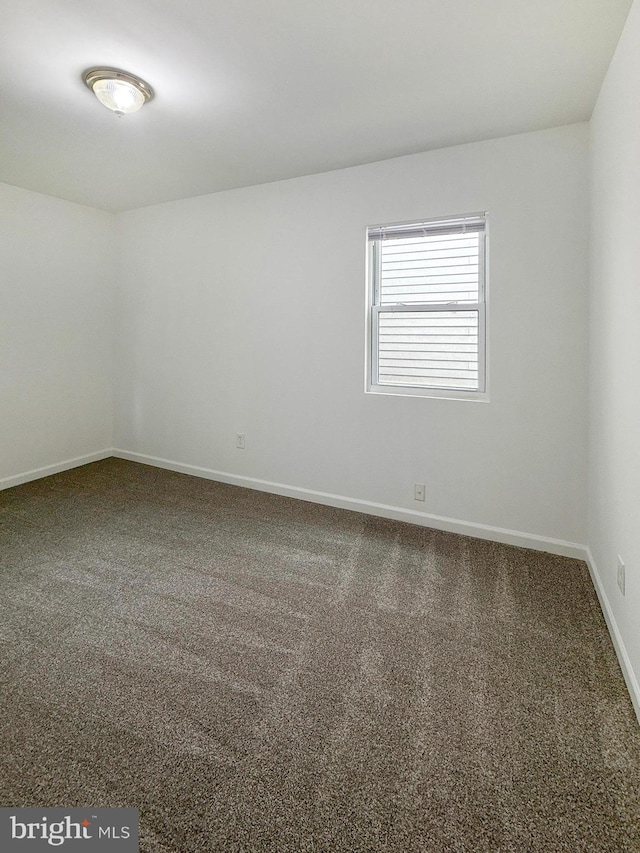1308 Gallaudet St NE, Washington, DC 20002 - empty room featuring carpet floors and baseboards
