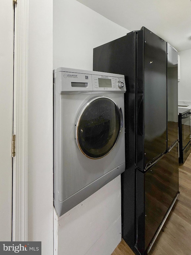 1308 Gallaudet St NE, Washington, DC 20002 - laundry area featuring washer / dryer and wood finished floors