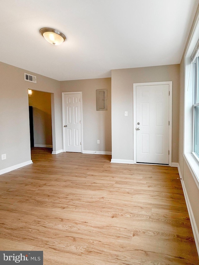1308 Gallaudet St NE, Washington, DC 20002 - spare room featuring electric panel and light wood-type flooring