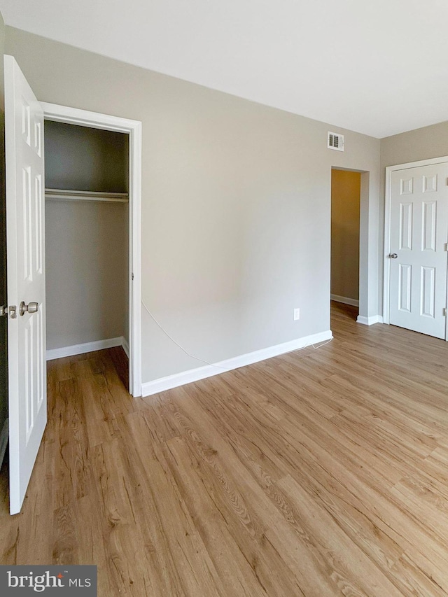 1308 Gallaudet St NE, Washington, DC 20002 - unfurnished bedroom featuring light wood-type flooring and a closet