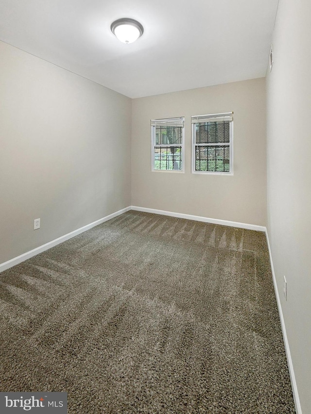 1308 Gallaudet St NE, Washington, DC 20002 - spare room with carpet