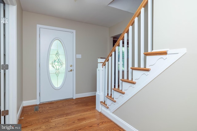 17 Bridleshire Rd, Newark, DE 19711 - entryway with baseboards, light wood-type flooring, and stairway