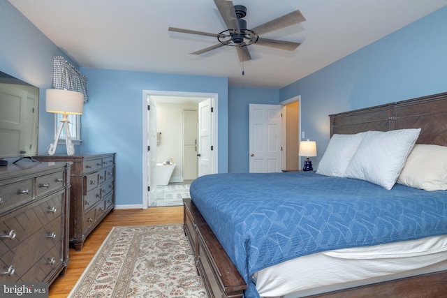 17 Bridleshire Rd, Newark, DE 19711 - bedroom featuring light wood-style floors, baseboards, and ensuite bath
